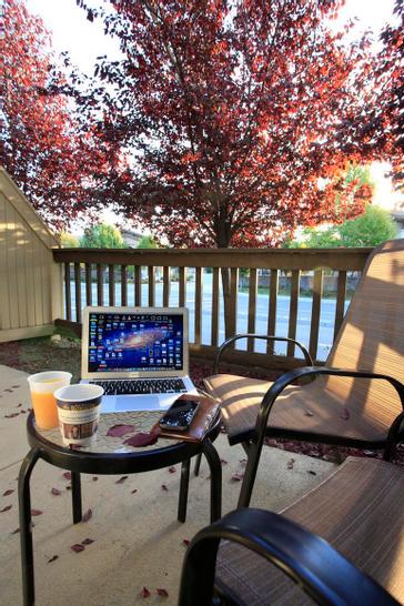 Pacific Plaza Hotels | Alameda, California | Laptop and coffee on outdoor patio table