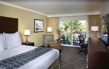 Pacific Plaza Hotels | Alameda, California | One king bedroom with seating area, balcony and desk