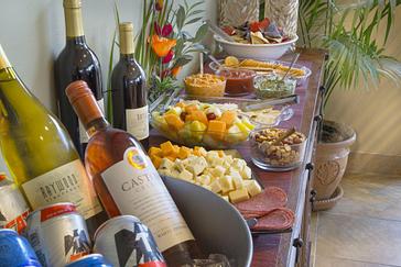 Pacific Plaza Hotels | Alameda, California | Spread of cheeses, fruits, pops and alcohol