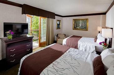 Pacific Plaza Hotels | Alameda, California | Two double beds with TV, dresser, balcony and seating area