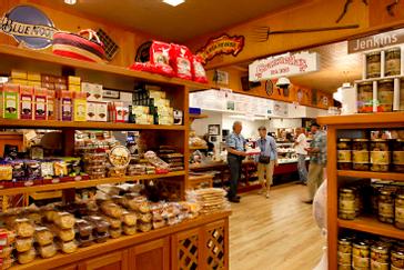 Pacific Plaza Hotels | Alameda, California | Brown shelves with cookies, jams and assorted products