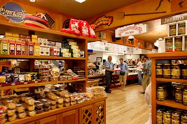 Pacific Plaza Hotels | Alameda, California | Brown shelves with cookies, jams and assorted products